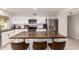 Modern kitchen with white cabinets and a large butcher block island at 1102 W Lindner Ave, Mesa, AZ 85210