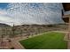 Landscaped backyard with artificial turf and mountain views at 14828 E Valley Vista Dr, Fountain Hills, AZ 85268