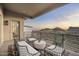 Spacious balcony featuring comfortable seating and picturesque mountain views with a beautiful sunset at 14828 E Valley Vista Dr, Fountain Hills, AZ 85268