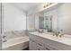 Modern bathroom with double vanity, soaking tub, and glass shower at 16657 S 21St St, Phoenix, AZ 85048