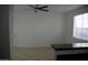 Living room with tiled floors, a ceiling fan, and access to the kitchen at 16657 S 21St St, Phoenix, AZ 85048