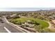 Aerial view of a community with a park, playground, and homes at 18280 W Sells Dr, Goodyear, AZ 85395