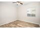 Simple bedroom with wood flooring and ceiling fan at 18280 W Sells Dr, Goodyear, AZ 85395