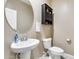 Small half bathroom with pedestal sink and toilet at 23800 W Pima St, Buckeye, AZ 85326