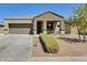 One-story home with a two-car garage and well-manicured landscaping at 23800 W Pima St, Buckeye, AZ 85326