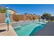 Inviting backyard pool with lounge chairs and umbrellas at 23800 W Pima St, Buckeye, AZ 85326