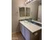 Bathroom vanity with bowl sink, modern faucet, mosaic backsplash, and dual mirrors at 280 S Evergreen Rd # 1301, Tempe, AZ 85288