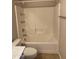 An all-white bathroom features a tub and shower combo with white wall tiles at 280 S Evergreen Rd # 1301, Tempe, AZ 85288