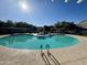 Circular community pool with a spa, lounge chairs, and a gazebo at 280 S Evergreen Rd # 1301, Tempe, AZ 85288
