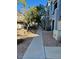 Paved walkway through a community with trees and desert landscaping at 280 S Evergreen Rd # 1301, Tempe, AZ 85288