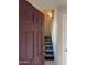 Inviting entryway featuring a modern front door and stairs leading to the upper level at 280 S Evergreen Rd # 1301, Tempe, AZ 85288