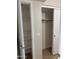 A hallway with an open closet/pantry and a sliding-door closet at 280 S Evergreen Rd # 1301, Tempe, AZ 85288