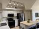 Modern kitchen featuring stainless steel appliances and island at 280 S Evergreen Rd # 1301, Tempe, AZ 85288