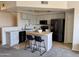 Modern kitchen with gray cabinets, an island, and stainless steel appliances at 280 S Evergreen Rd # 1301, Tempe, AZ 85288