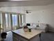 Spacious living room with large windows, comfortable seating, and a ceiling fan at 280 S Evergreen Rd # 1301, Tempe, AZ 85288