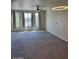 Bright and airy living room with large windows and soft carpeting, perfect for relaxation at 280 S Evergreen Rd # 1301, Tempe, AZ 85288
