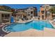 Community pool with surrounding lounge chairs and pergola at 280 S Evergreen Rd # 1301, Tempe, AZ 85288