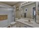 Clean bathroom with updated vanity and shower at 3212 E Desert Cove Ave, Phoenix, AZ 85028