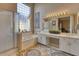 Spa-like bathroom with double sinks, a soaking tub and a walk-in shower at 3212 E Desert Cove Ave, Phoenix, AZ 85028