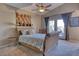 Spacious bedroom with a sleigh bed and access to a private patio at 3212 E Desert Cove Ave, Phoenix, AZ 85028