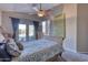 Serene bedroom with a sleigh bed and access to a private patio and pool at 3212 E Desert Cove Ave, Phoenix, AZ 85028