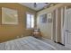 Bright bedroom with a comfortable bed and charming chair at 3212 E Desert Cove Ave, Phoenix, AZ 85028