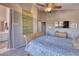 Relaxing bedroom with a sleigh bed and access to the bathroom at 3212 E Desert Cove Ave, Phoenix, AZ 85028