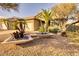 One-story house with two modern planters and desert plants at 3212 E Desert Cove Ave, Phoenix, AZ 85028
