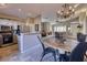 Open concept kitchen features stainless steel appliances and views to the living room at 3212 E Desert Cove Ave, Phoenix, AZ 85028