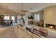 Open living room showcasing a fireplace and adjacent dining area at 3212 E Desert Cove Ave, Phoenix, AZ 85028