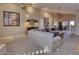 Bright living room featuring a large sectional sofa and neutral color palette at 3212 E Desert Cove Ave, Phoenix, AZ 85028