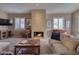 Cozy living room with a fireplace and comfortable seating at 3212 E Desert Cove Ave, Phoenix, AZ 85028