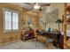 Home office features built-in shelving and hardwood desk at 3212 E Desert Cove Ave, Phoenix, AZ 85028