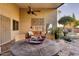 Outdoor patio with seating area and ceiling fan at 3212 E Desert Cove Ave, Phoenix, AZ 85028