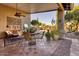 Covered patio with seating area and pool view at 3212 E Desert Cove Ave, Phoenix, AZ 85028
