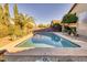 Inviting rectangular pool, surrounded by desert landscaping at 3212 E Desert Cove Ave, Phoenix, AZ 85028