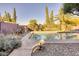 Relaxing pool area with patio furniture and landscaping at 3212 E Desert Cove Ave, Phoenix, AZ 85028