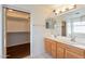 Double vanity bathroom with large mirror and closet at 3555 S Payton St, Mesa, AZ 85212