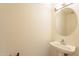 Clean bathroom with pedestal sink and oval mirror at 3555 S Payton St, Mesa, AZ 85212