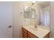 Clean bathroom with vanity, mirror, and wood cabinets at 3555 S Payton St, Mesa, AZ 85212
