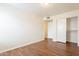 Spacious bedroom with wood-look floors and mirrored closet at 3555 S Payton St, Mesa, AZ 85212