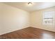 Bright bedroom with wood-look floors and window with blinds at 3555 S Payton St, Mesa, AZ 85212