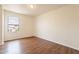Bright bedroom with wood-look floors and a large window at 3555 S Payton St, Mesa, AZ 85212
