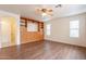 Living room with built-in shelving and hardwood floors at 3555 S Payton St, Mesa, AZ 85212