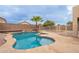 Relaxing kidney-shaped pool with a waterfall feature at 3555 S Payton St, Mesa, AZ 85212