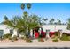 Bright white house with red front door and nicely landscaped yard at 6012 E Redfield Rd, Scottsdale, AZ 85254