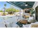 Relaxing covered patio with seating area near the pool at 6012 E Redfield Rd, Scottsdale, AZ 85254