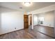 Bright bedroom with wood floors and mirrored closet doors at 6431 W Sierra St, Glendale, AZ 85304