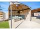 Relaxing covered patio with fire pit and seating area at 6431 W Sierra St, Glendale, AZ 85304