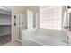 Bathroom with a shower, tub, and closet at 8141 E Apache Plumb Dr, Gold Canyon, AZ 85118